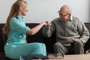 Granddad with a nurse on the journey of caring for care