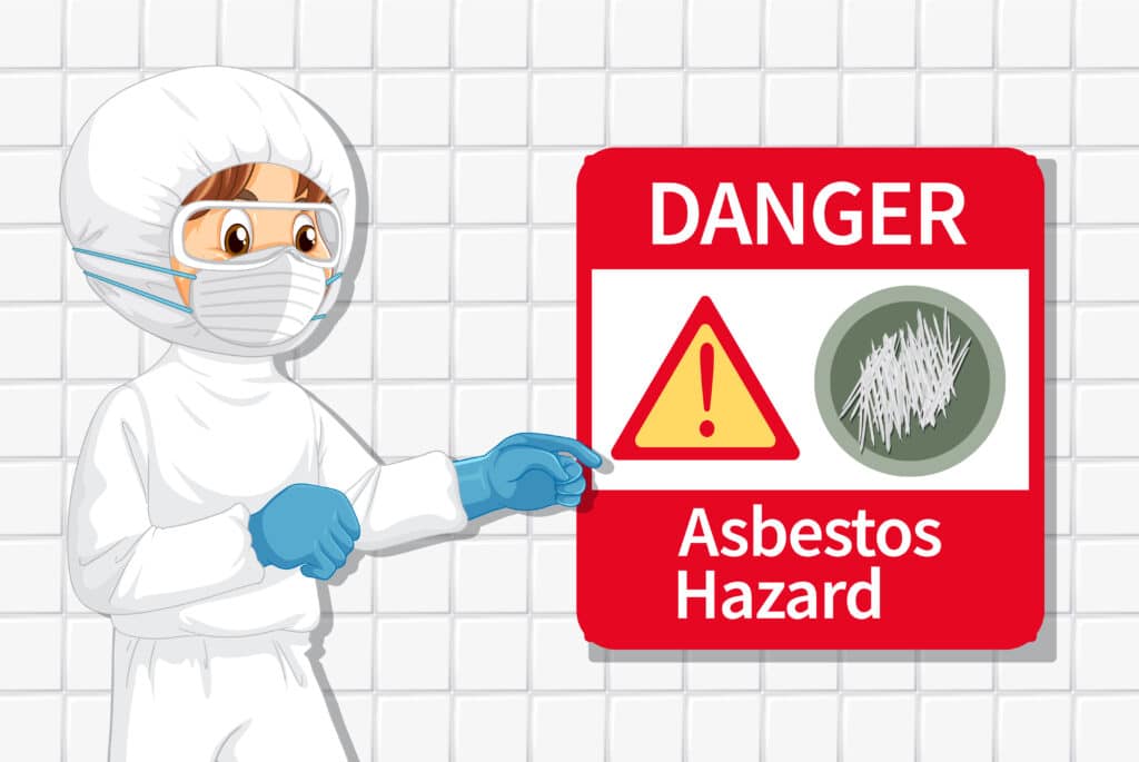 Man wearing protective equipment and showing asbestos hazard signage.